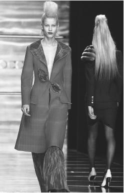 Rocco Barocco, fall/winter 2001-02 collection: coat with satin trim and collar, and satin pants. © AP/Wide World Photos.