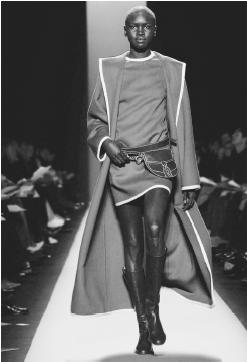 Michael Kors, fall 2001 collection: wool ruana over a merino pullover and stretch flannel britches. © AP/Wide World Photos.