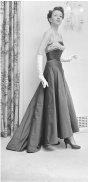 Maurice Rentner, 1952 collection: silk satin evening gown with an abbreviated beaded bodice superimposed on top. © Bettmann/CORBIS.
